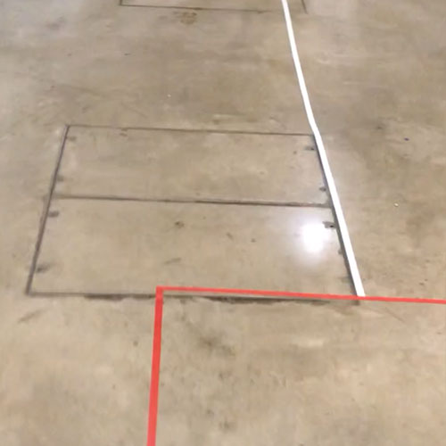 A red and white line come together on the floor